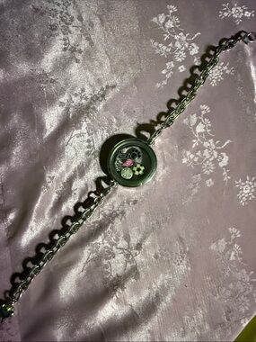 Origami owl? Charm bracelet.
